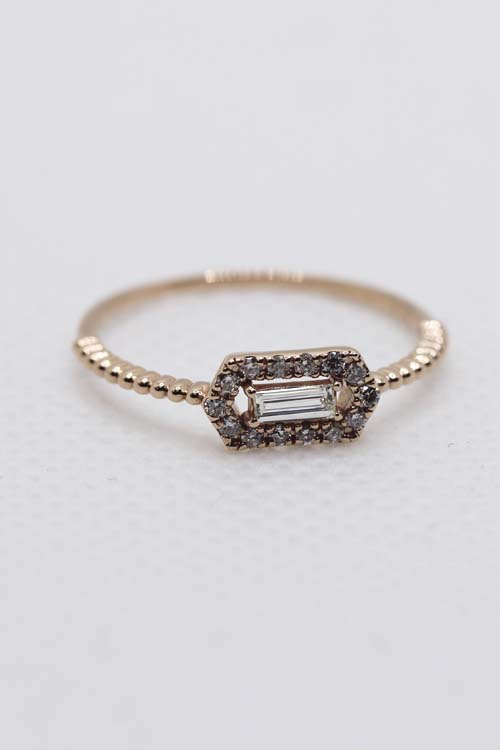 delicate emerald cut diamond engagement ring