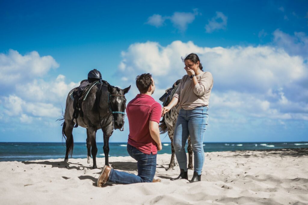 couple getting engaged on the beach